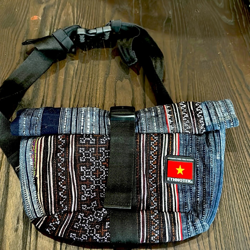 Ethnotex roll down top crossbody bag.